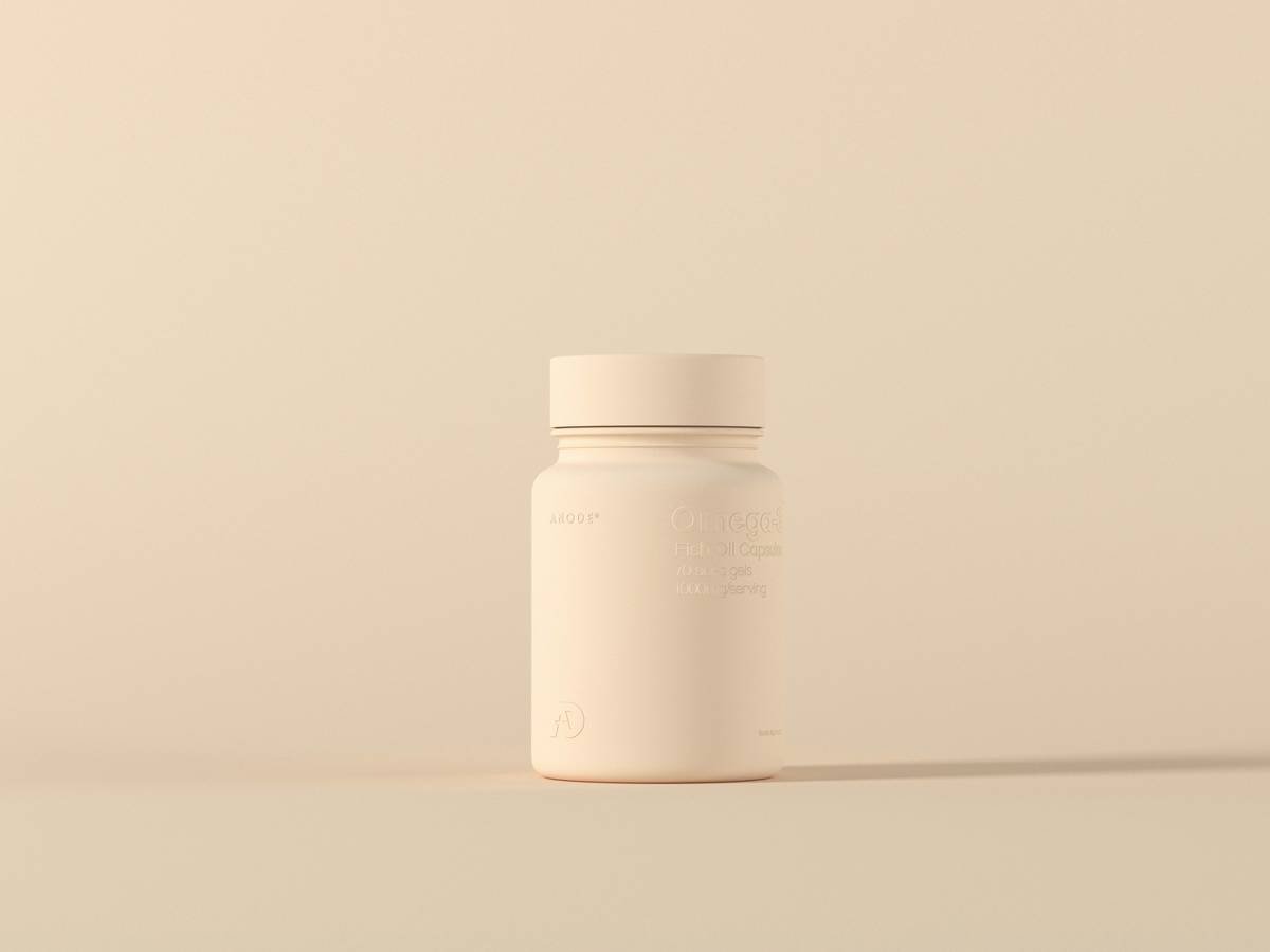 A steaming cup of red clover tea placed on a wooden table